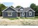 Home exterior with dark siding, clean white trim, and a welcoming facade on a new build at 53 Stonewood Loop Ln, Henderson, NC 27537