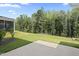 Large grassy backyard, perfect for outdoor activities, with a patio at 544 Tanner Lake Ln, Raleigh, NC 27610