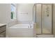 This primary bathroom features a soaking tub and glass enclosed shower at 544 Tanner Lake Ln, Raleigh, NC 27610