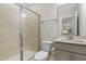 Bathroom features a glass-enclosed shower, vanity with sink, and neutral walls at 544 Tanner Lake Ln, Raleigh, NC 27610