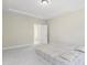 An empty bedroom with neutral walls, a tray ceiling, and plush carpeting at 544 Tanner Lake Ln, Raleigh, NC 27610