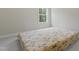 This bedroom offers plush carpeting and a window with wooded views at 544 Tanner Lake Ln, Raleigh, NC 27610