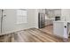 Bright, modern kitchen and dining area featuring stainless steel appliances and a breakfast nook at 544 Tanner Lake Ln, Raleigh, NC 27610