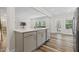Stylish kitchen with a center island, stainless steel appliances, open layout, and hardwood floors at 544 Tanner Lake Ln, Raleigh, NC 27610