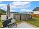 The above ground pool is surrounded by a bench, an umbrella and fenced backyard at 553 Sturgeon St, Smithfield, NC 27577