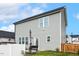 Grey two-story home boasts a backyard with an above ground pool, bench and an umbrella at 553 Sturgeon St, Smithfield, NC 27577