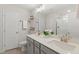 Bathroom featuring double sinks, quartz countertops, modern faucets, and tiled floor at 553 Sturgeon St, Smithfield, NC 27577