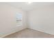 Bright carpeted bedroom with light walls and a window at 553 Sturgeon St, Smithfield, NC 27577