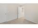 Cozy bedroom featuring neutral walls, plush carpet, and a partially opened doorway at 553 Sturgeon St, Smithfield, NC 27577