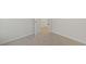 Carpeted bedroom with a view into the hallway at 553 Sturgeon St, Smithfield, NC 27577