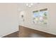 Bright dining room with hardwood floors, a modern chandelier, and large window at 553 Sturgeon St, Smithfield, NC 27577
