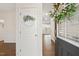 Inviting foyer with hardwood floors and a door featuring a decorative wreath at 553 Sturgeon St, Smithfield, NC 27577