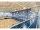 Modern gymnasium with hardwood basketball court and elevated running track, perfect for athletes and fitness buffs at 553 Sturgeon St, Smithfield, NC 27577