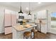 Modern kitchen with white cabinets, granite countertops, and stainless steel appliances at 553 Sturgeon St, Smithfield, NC 27577