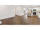 Spacious living room with an open floor plan showcasing wood floors, leading to the kitchen at 553 Sturgeon St, Smithfield, NC 27577