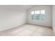 Bright bedroom showcasing a large window, neutral carpet, and crisp, white walls at 5560 Henley Ridge Dr # 187, Graham, NC 27253