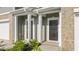 Inviting townhome entrance with columns and tidy landscaping at 5560 Henley Ridge Dr # 187, Graham, NC 27253