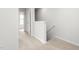 View of hallway with neutral carpet, white walls, and white trim at 5560 Henley Ridge Dr # 187, Graham, NC 27253