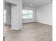 Spacious living room with light wood-look flooring and natural light at 5560 Henley Ridge Dr # 187, Graham, NC 27253
