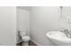 This powder room features modern fixtures and a pedestal sink at 5560 Henley Ridge Dr # 187, Graham, NC 27253