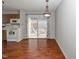 Bright dining area with wood floors and sliding glass doors to the outdoor deck at 6016 Farm Gate Rd, Raleigh, NC 27606