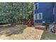 View of the home's back exterior and wooden deck at 605 Catlin Rd, Cary, NC 27519