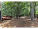 Backyard with deck and wooded area at 605 Catlin Rd, Cary, NC 27519