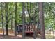 Wooded backyard featuring a wooden deck at 605 Catlin Rd, Cary, NC 27519