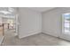 Carpeted bedroom with light-filled window and neutral-toned walls at 605 Catlin Rd, Cary, NC 27519
