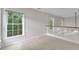 Spacious room with carpet floors and lots of natural light from the large window at 605 Catlin Rd, Cary, NC 27519