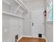 Utility closet with open shelves, electrical connections and access to the backyard at 605 Catlin Rd, Cary, NC 27519