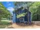 Side view of charming home with lush landscaping at 605 Catlin Rd, Cary, NC 27519