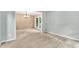 Open-concept living room featuring neutral colors and a large window overlooking the front yard at 605 Catlin Rd, Cary, NC 27519