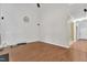 Spacious living room with beautiful wood floors, high ceilings, and ample natural light at 605 Catlin Rd, Cary, NC 27519