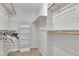 Walk-in closet with open shelving and hanging racks for efficient storage at 605 Catlin Rd, Cary, NC 27519