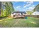 Spacious backyard with a large deck, perfect for outdoor entertaining at 609 N Country Club Dr, Oxford, NC 27565