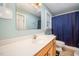 Bathroom featuring a toilet, shower, curtain and sink at 609 N Country Club Dr, Oxford, NC 27565