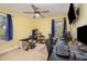 Bedroom setup with a desk for office work and a ceiling fan for cooling at 609 N Country Club Dr, Oxford, NC 27565