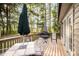 An outdoor deck with patio furniture, perfect for relaxing and entertaining at 609 N Country Club Dr, Oxford, NC 27565