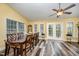 Open-concept dining room featuring wood flooring, and natural light at 609 N Country Club Dr, Oxford, NC 27565