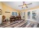Spacious dining room with a large table, natural light, and sliding glass doors at 609 N Country Club Dr, Oxford, NC 27565
