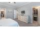 Cozy bedroom with carpet, a queen bed, dresser, closet, and great natural light at 6612 Enrichment Ln, Raleigh, NC 27616