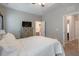 Cozy bedroom featuring a neutral color palette, plush bedding, and ample natural light at 6612 Enrichment Ln, Raleigh, NC 27616