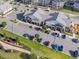 Aerial view of commercial space with visible parking, landscaping and amenities at 6612 Enrichment Ln, Raleigh, NC 27616