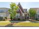 Charming two-story home with brick accents, manicured lawn, and mature landscaping at 6612 Enrichment Ln, Raleigh, NC 27616