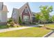 Beautiful home showcasing well-maintained landscaping and vibrant green lawn in a sunny neighborhood at 6612 Enrichment Ln, Raleigh, NC 27616