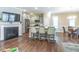 Modern kitchen with stainless steel appliances, breakfast bar, and view into the dining area at 6612 Enrichment Ln, Raleigh, NC 27616