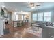Open-concept living room features hardwood floors, modern decor, and ample natural light at 6612 Enrichment Ln, Raleigh, NC 27616