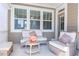 Relaxing porch area with stylish furniture, ideal for enjoying outdoor living at 6612 Enrichment Ln, Raleigh, NC 27616