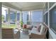 Charming screened porch with comfortable seating, creating a peaceful outdoor retreat at 6612 Enrichment Ln, Raleigh, NC 27616